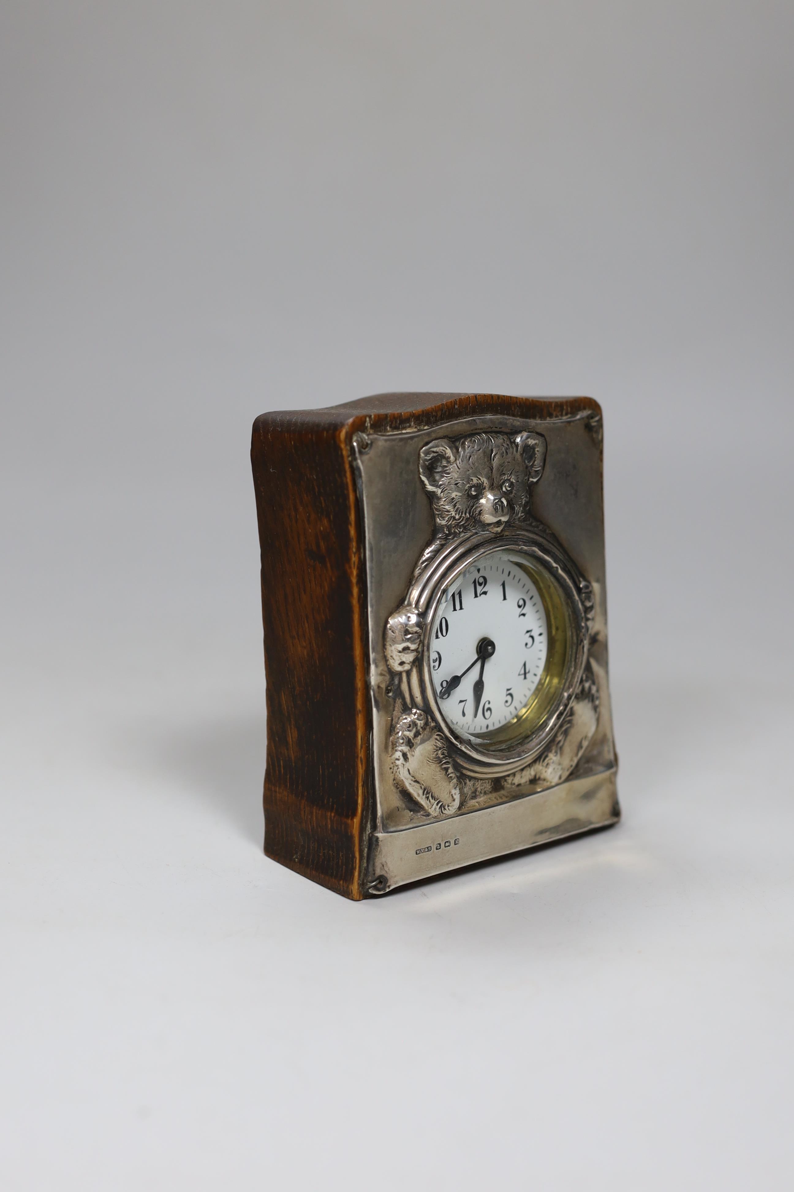 A rare silver teddy bear clock, Birmingham 1909 hallmarked, 5in.